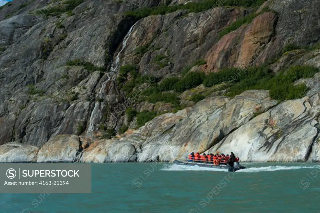 DIP boat with tourists cruising near the Dawes Glacier, Endicott Arm, Tongass National Forest, Alaska, USA