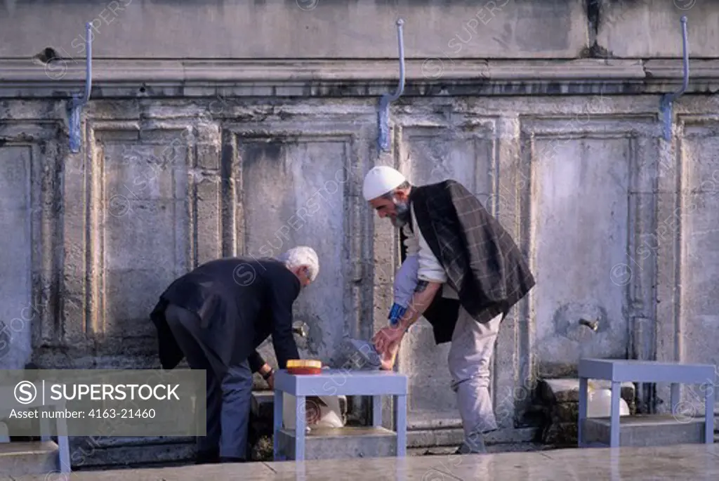 Turkey, Istanbul, Suleymaniye Mosque, Man Washing Feet