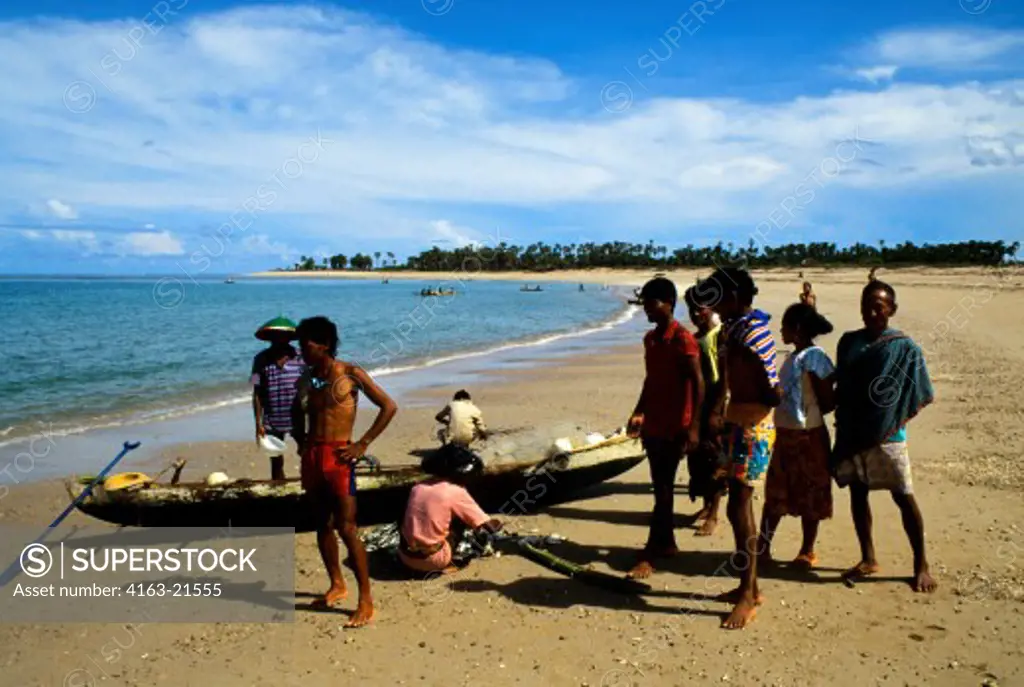 INDONESIA, SAWU (SEBA) ISLAND FISHERMEN SORTING CATCH ON BEACH