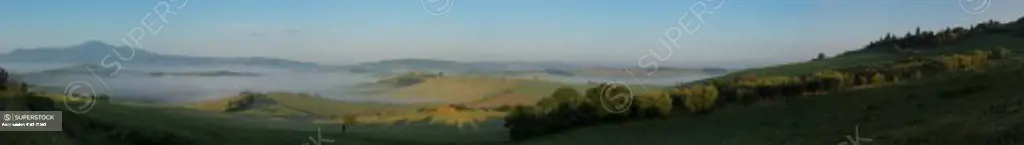 Panorama photo (90 x 13 inches) of early morning fog in the Val d'Orcia near Pienza in Tuscany, Italy