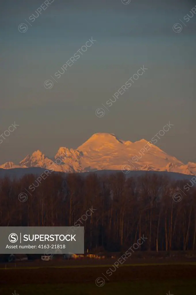 View At Sunset Of Mount Baker In The North Cascade Mountains From The Skagit Valley In Washington StateUSA,