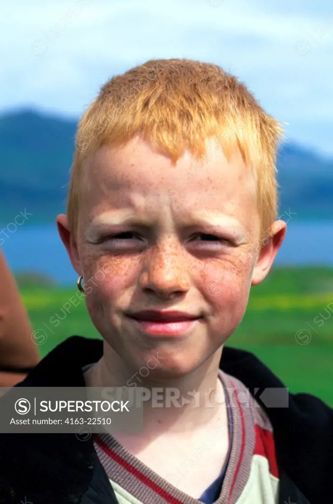 Iceland, East Coast, Icelandic Boy Portrait With Earring