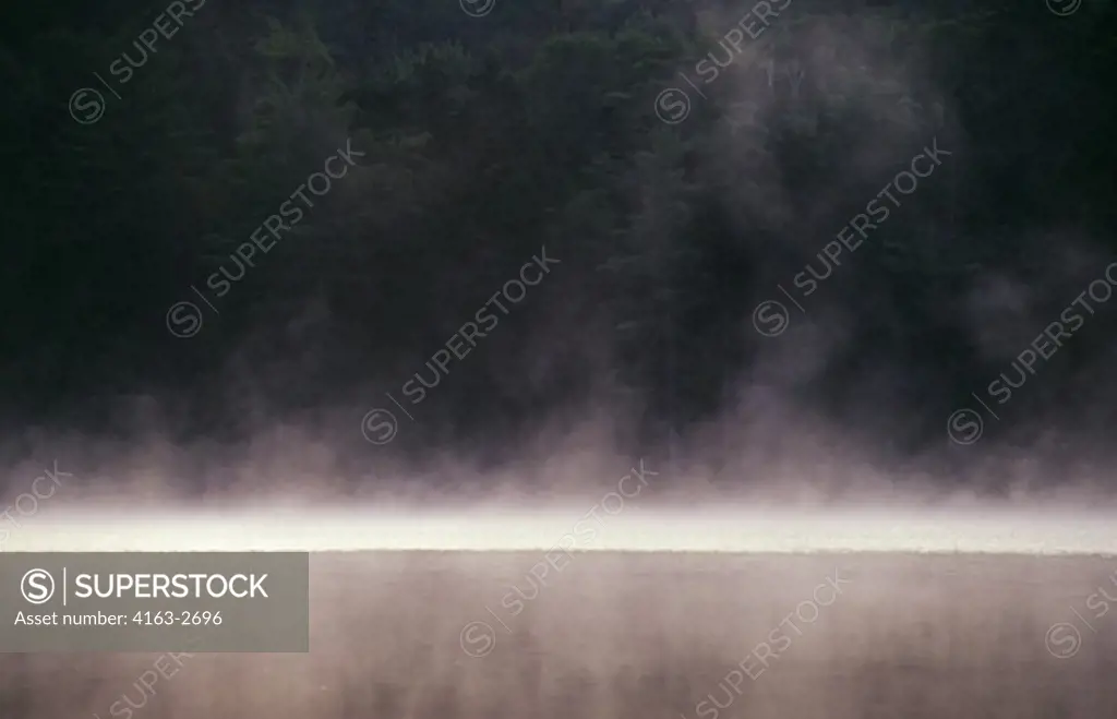 USA, MAINE, NEAR STRATTON, LITTLE JIM POND, EARLY MORNING, FOG RISING