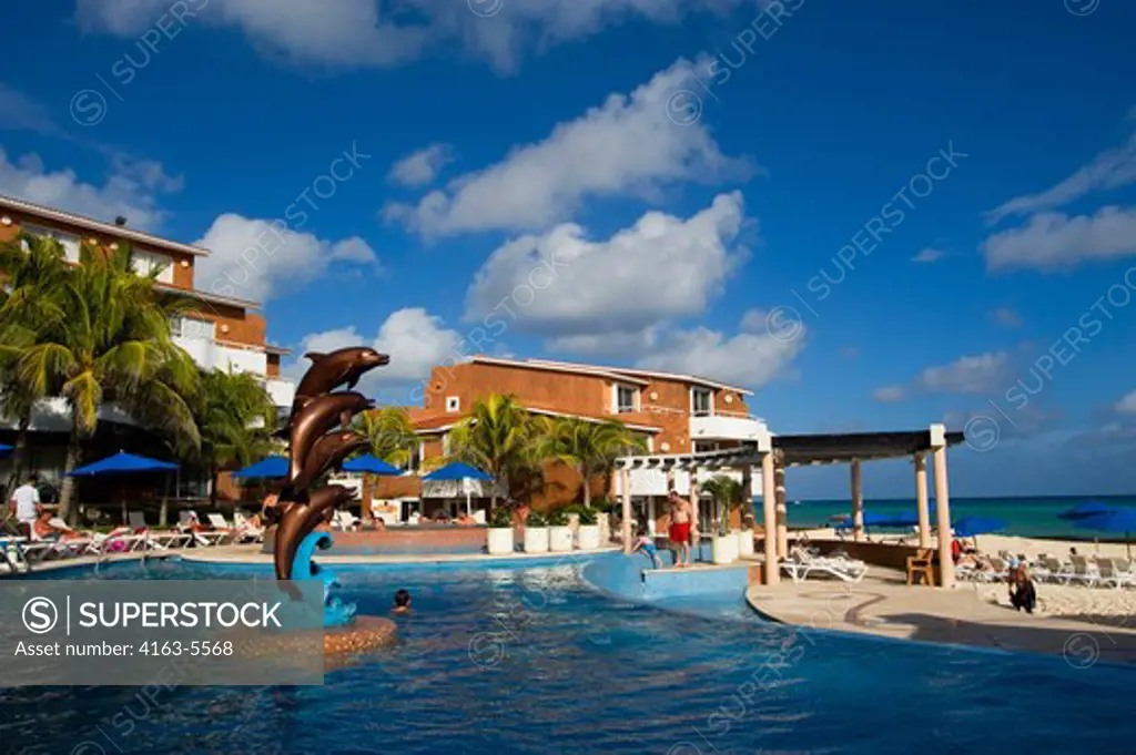 MEXICO, NEAR CANCUN, PLAYA DEL CARMAN, SUNSET FISHERMEN'S SPA AND RESORT, SWIMMING POOL WITH DOLPHIN STATUE