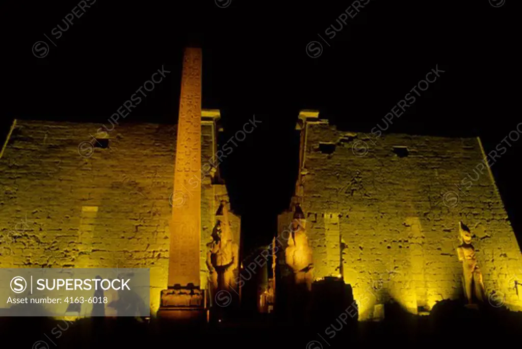 EGYPT, LUXOR, TEMPLE OF LUXOR ILLUMINATED AT NIGHT, OBELISK