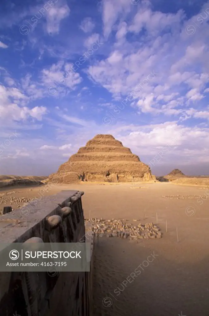 EGYPT, NEAR CAIRO, SAKKARA, STEP PYRAMID, COBRA HEADS IN FOREGROUND