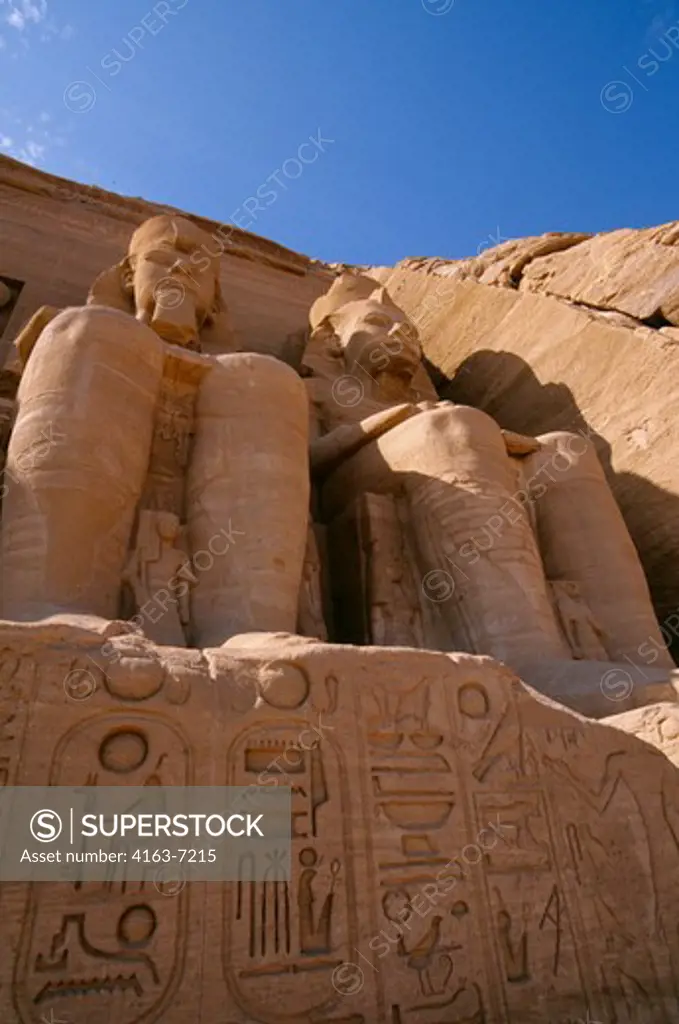 EGYPT, ABU SIMBEL, GREAT TEMPLE OF ABU SIMBEL, STATUES OF RAMSES II, HIEROGLYPHS