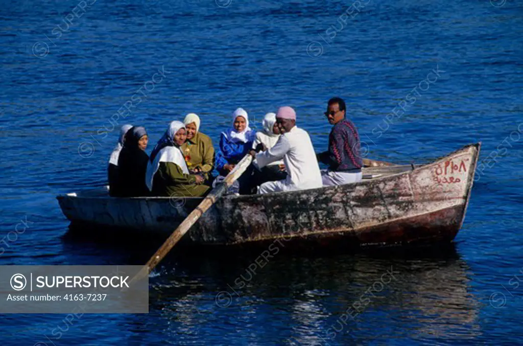 EGYPT, ASWAN, NILE RIVER, LOCAL PEOPLE IN ROW BOAT
