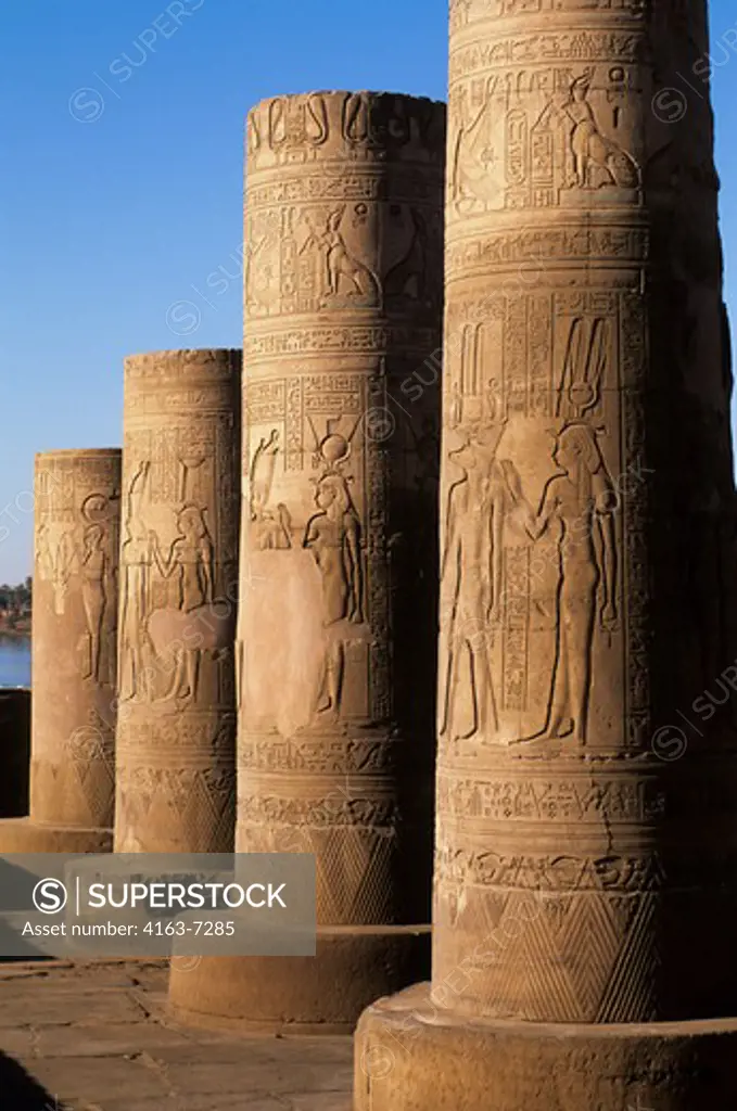 EGYPT, NILE RIVER, KOM OMBO TEMPLE, COLUMNS WITH RELIEF CARVINGS