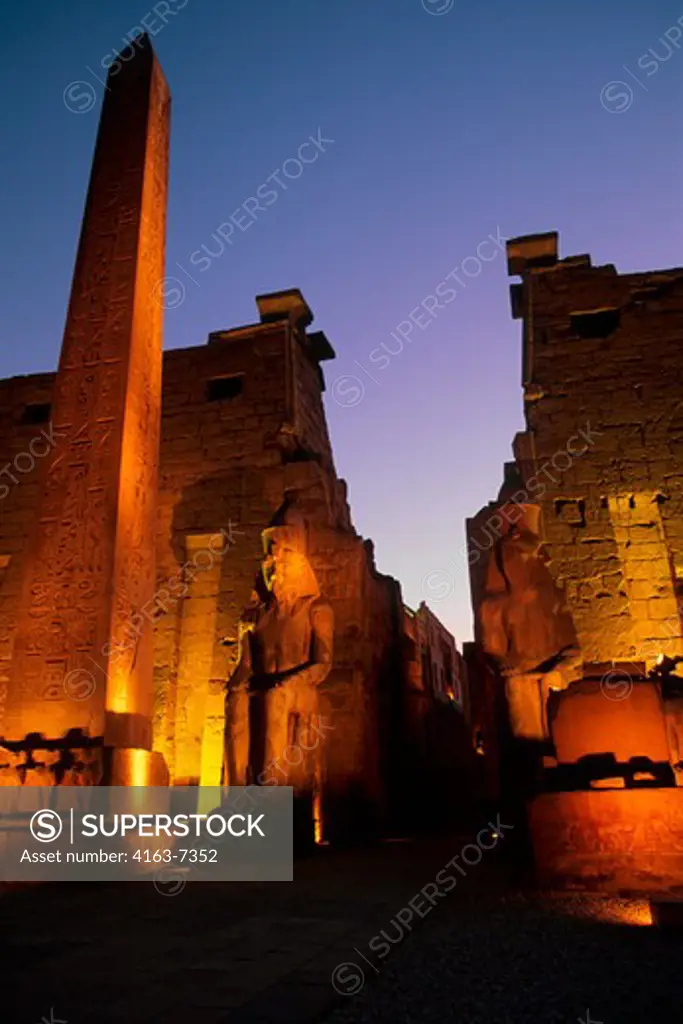 EGYPT, NILE RIVER, LUXOR, TEMPLE OF LUXOR, ENTRANCE WITH OBELISK AT NIGHT