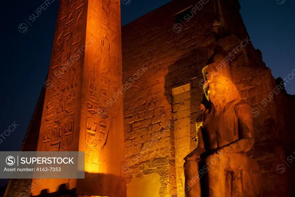 EGYPT, NILE RIVER, LUXOR, TEMPLE OF LUXOR, ENTRANCE WITH OBELISK AT NIGHT