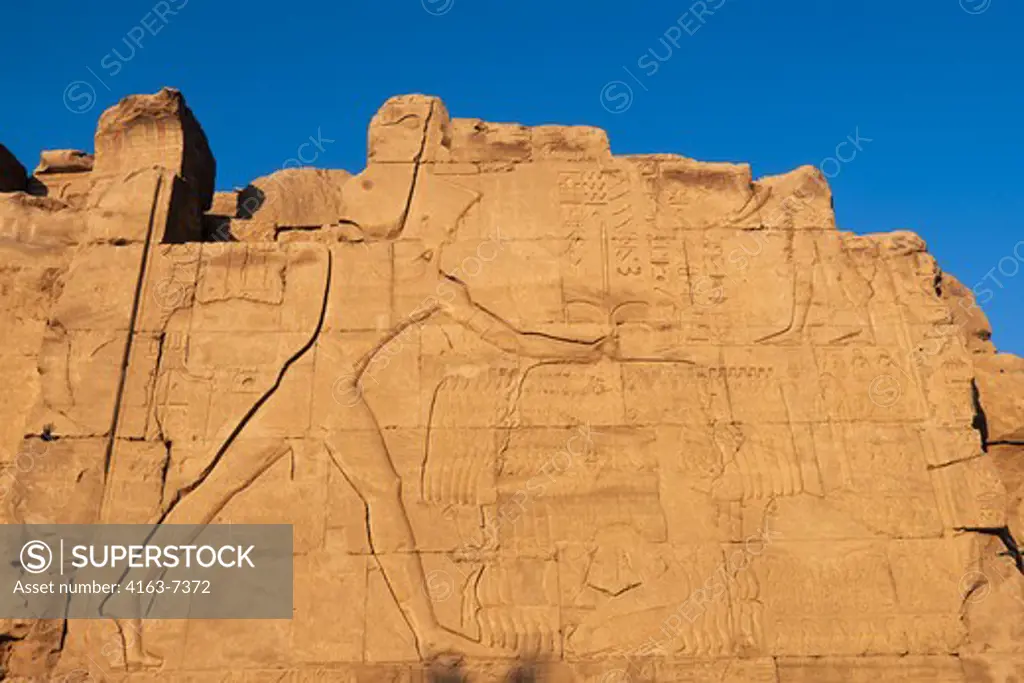 EGYPT, NILE RIVER, LUXOR, TEMPLE OF KARNAK, SEVENTH PYLON, RELIEF CARVING