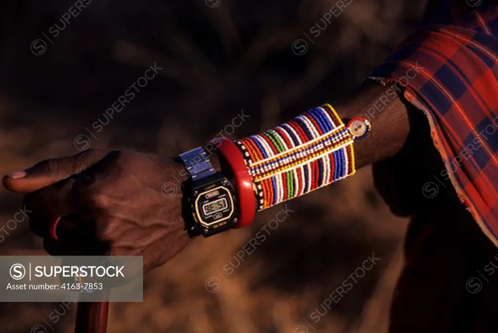 KENYA, AMBOSELI, MASAI MAN, CLOSE-UP OF ARM JEWELERY WITH MODERN WATCH