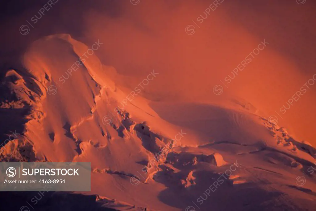 ANTARCTIC PENINSULA AREA, GLACIER COVERED MOUNTAIN IN MIDNIGHT SUNLIGHT