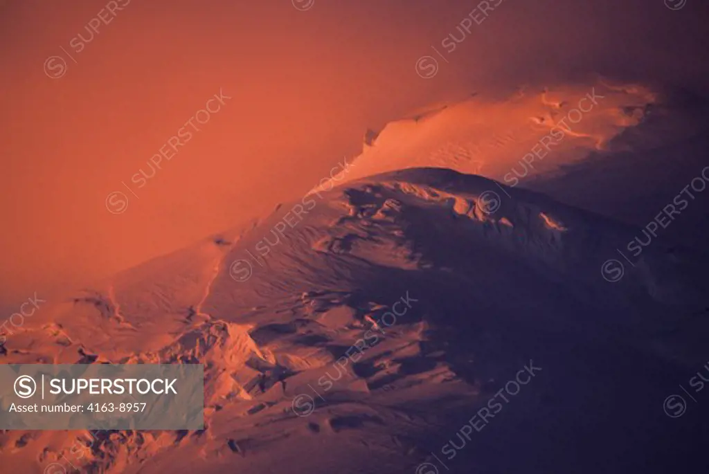 ANTARCTIC PENINSULA AREA, MIDNIGHT SUNLIGHT ON GLACIER COVERED MOUNTAIN