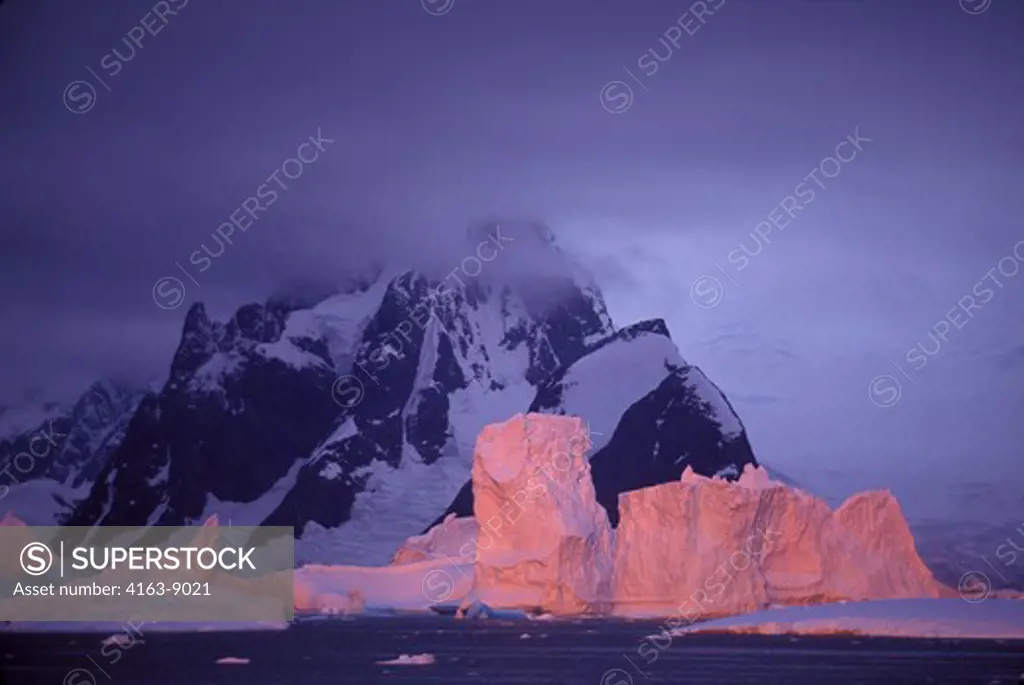 ANTARCTIC PENINSULA, ARGENTINE ISLANDS, ICEBERGS REFLECTING SUNSET