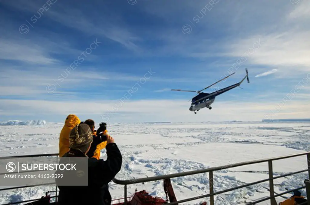 ANTARCTICA, WEDDELL SEA, ICEBREAKER KAPITAN KHLEBNIKOV, TOURISTS WATCHING HELICOPTER