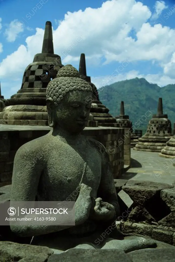 INDONESIA, JAVA, ANCIENT BOROBUDUR BUDDHIST TEMPLE, UPPER TER- RACE WITH BELL STUPAS