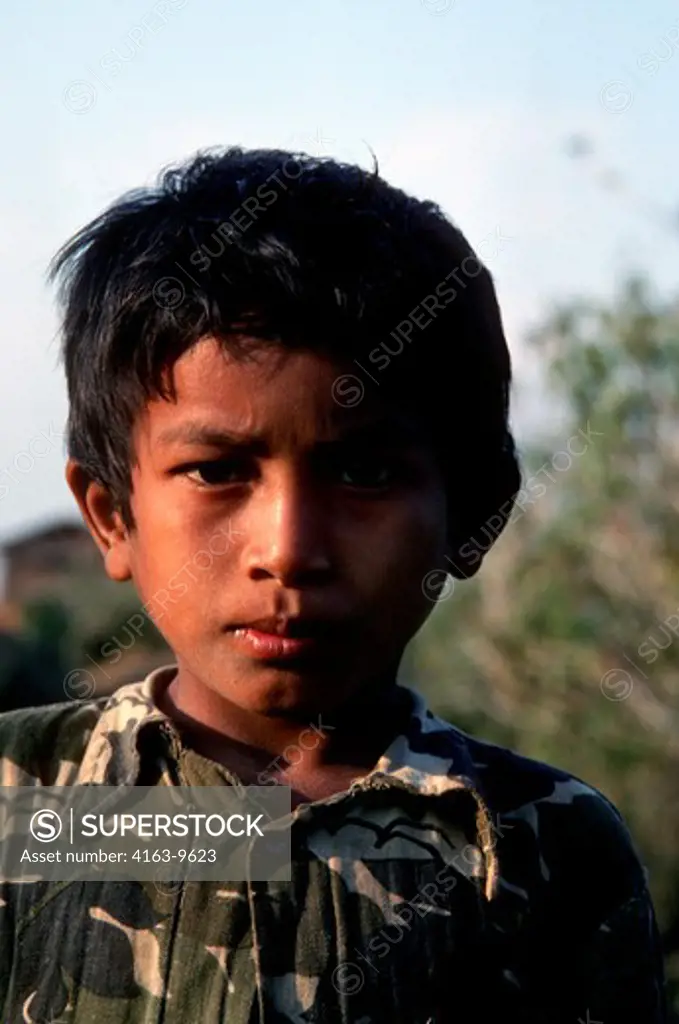 NEPAL, THARU VILLAGE, NEAR TIGER TOP GAME RESERVE, PORTRAIT OF BOY