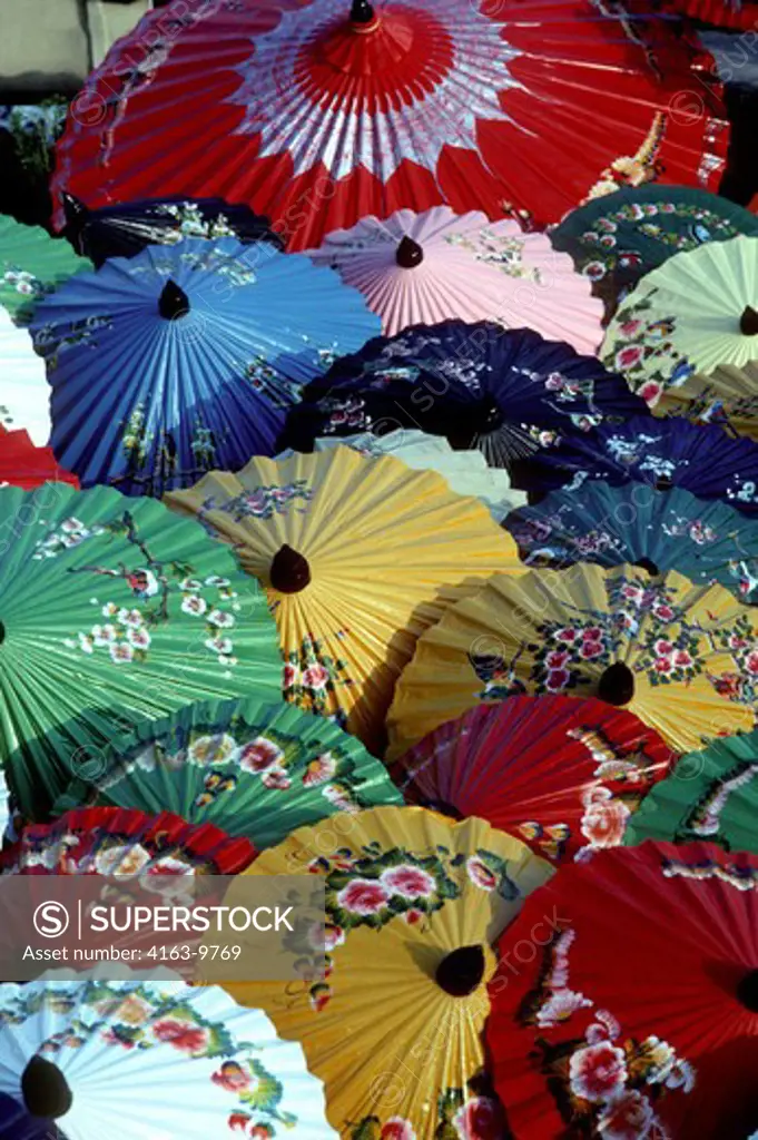 NORTH THAILAND, CHIANG MAI, COLORFUL PAPER PARASOLS DRYING AFTER PAINTING