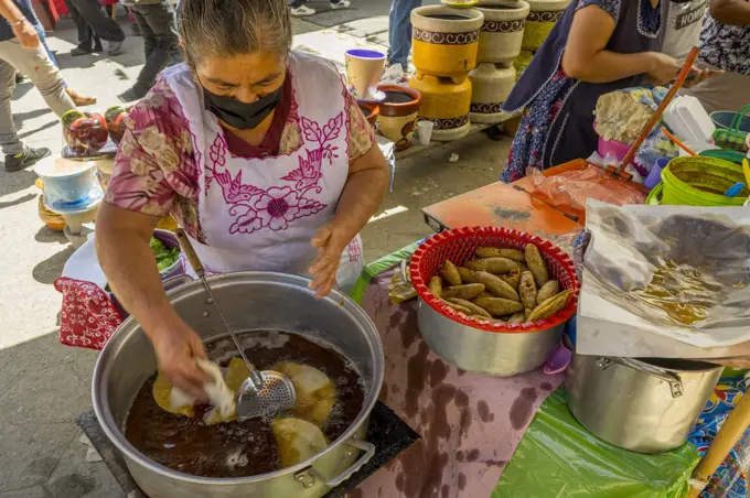 A street kitchen id selling meals on the weekly indigenous market in the small town of Zaachila near Oaxaca City, Mexico.