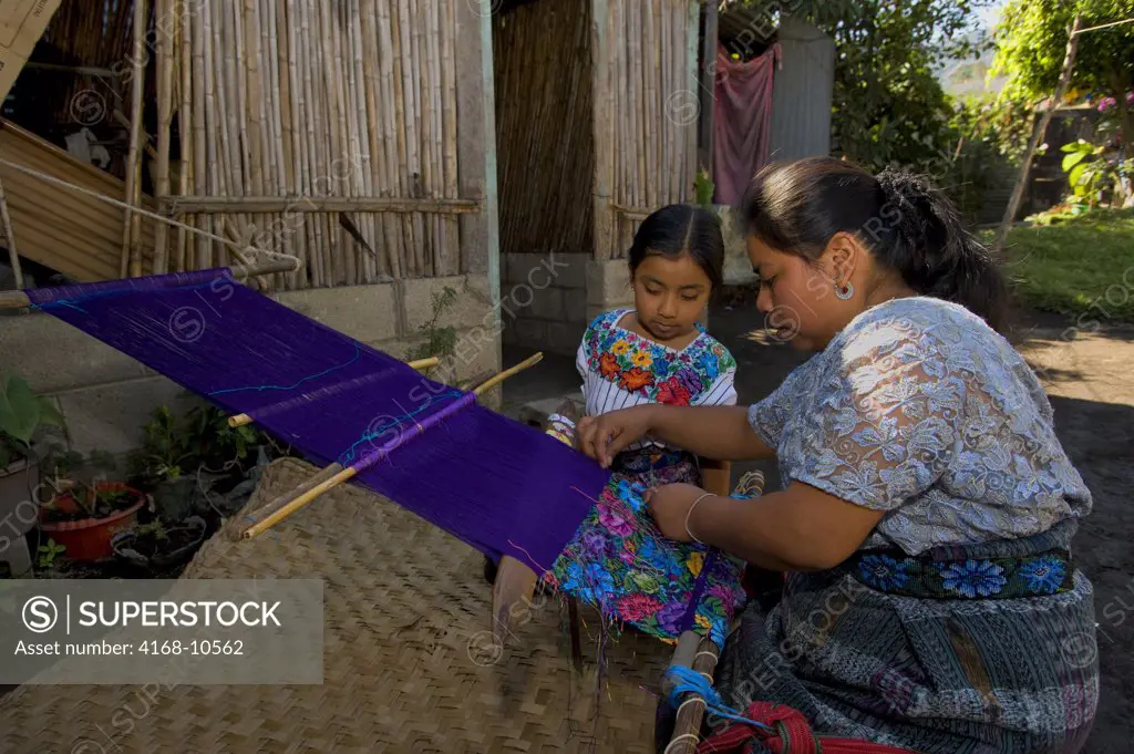 Guatemala, Highlands, Near Antigua, Santa Catarina Barahona, Home Of Mayan Family, Woman Weaving Fabric