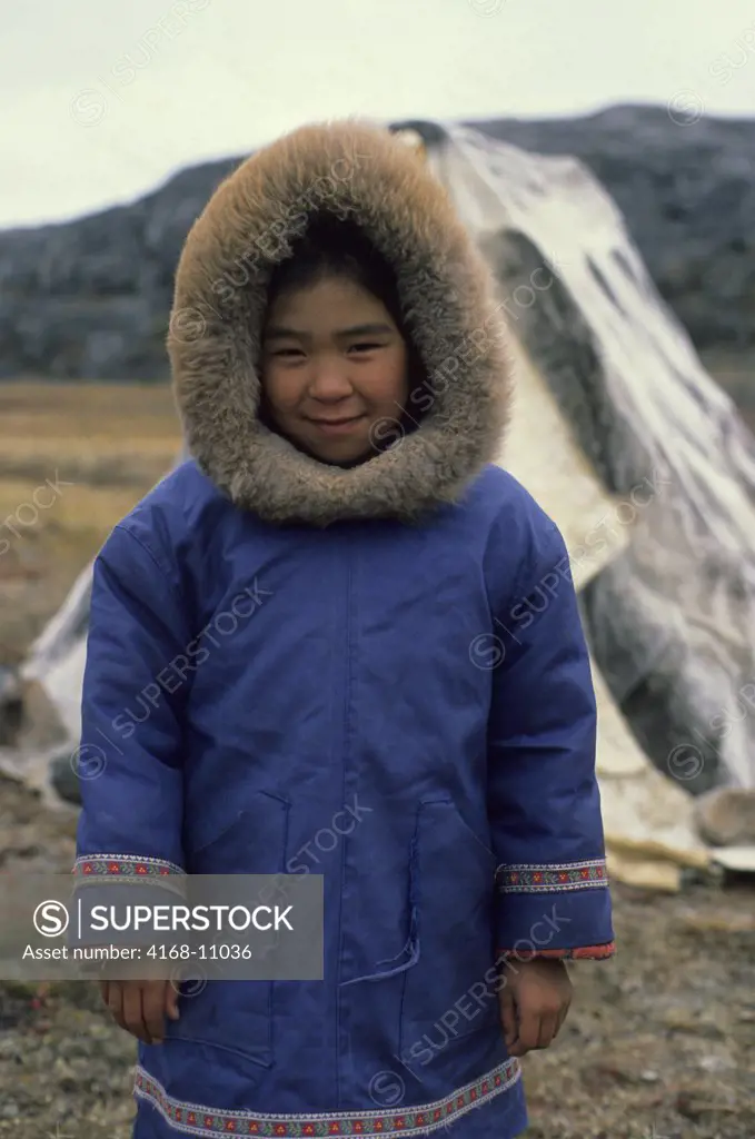 Canada, Nunavut, Hudson Bay, Baffin Island,Cape Dorset, Inuit Girl In Front Of Sealskin Tent