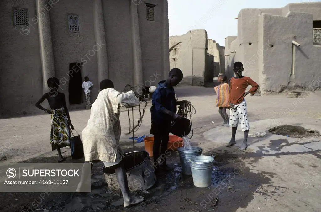 Mali, Djenne, Street Scene Children Getting Water From Well