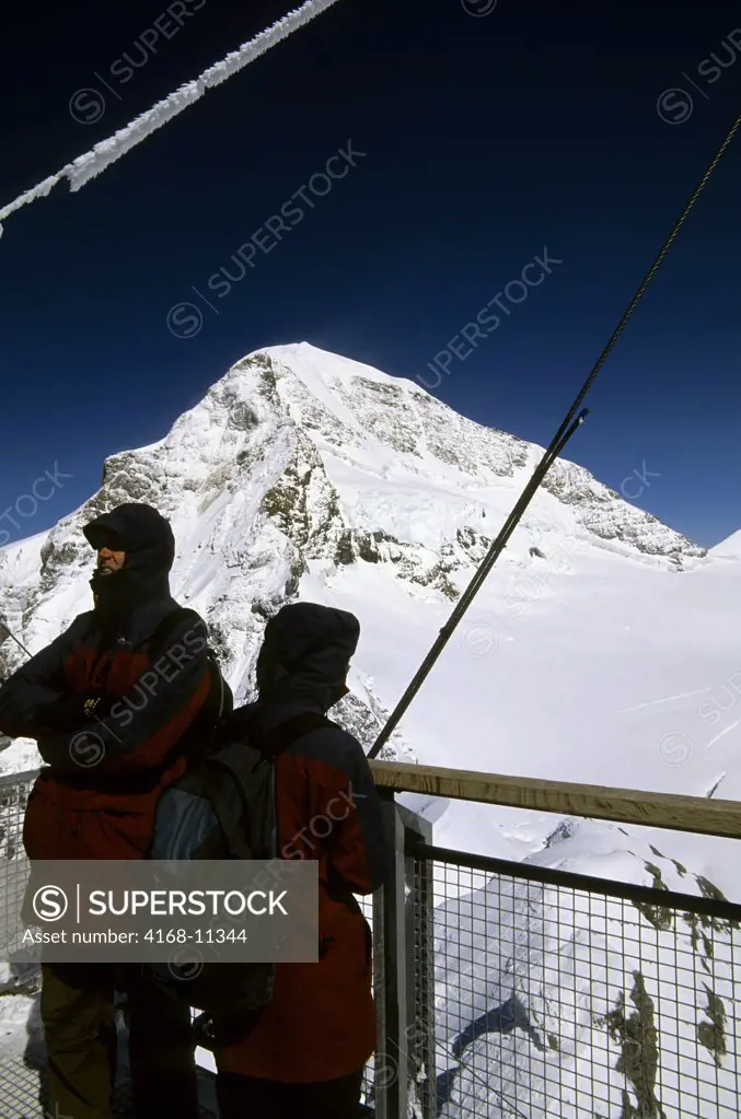 Switzerland, Bernese Oberland, Jungfraujoch, Sphinx Viewpoint, People, Monch Mountain In Background