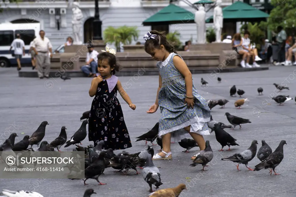 Puerto Rico, San Juan, Plaza De Armas, Local Girls Feeding Pigeons