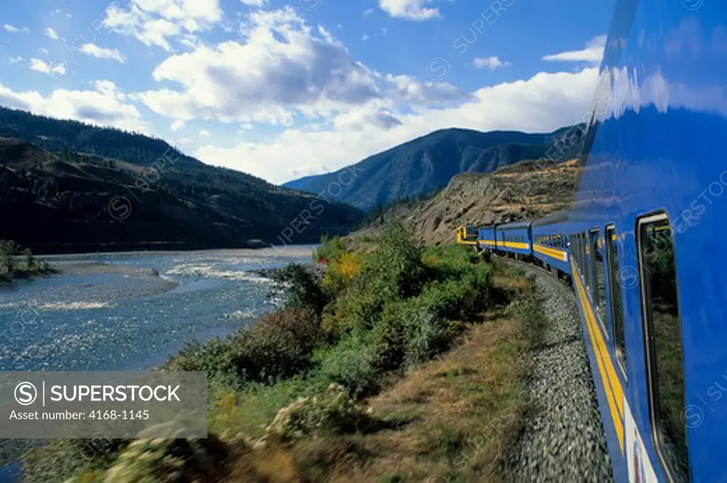 CANADA,BRITISH COLUMBIA, 'ROCKY MOUNTAINEER' TRAIN TRAVELING ALONG THOMPSON RIVER. Pre-2010 train.