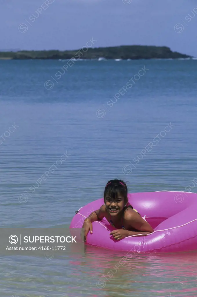 Puerto Rico, Near Fajardo Beach, Local Girl With Pink Innertube