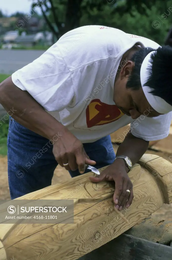 USA,Washington, Near La Conner, Swinomish Indian Reservation, Native American Wood Carver Kevin Paul Working On Totem Pole