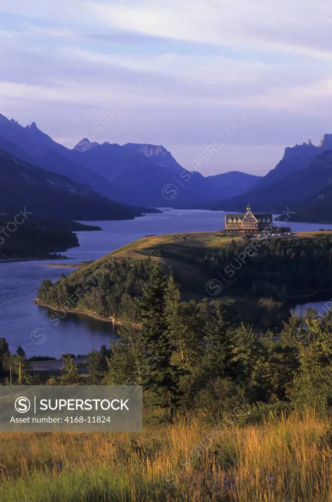 Canada, Alberta, Waterton National Park, Waterton Lake With Prince Of Wales Hotel, Grass
