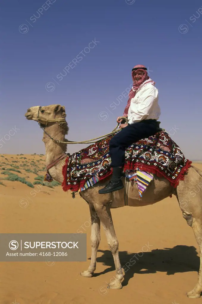 Saudi Arabia, Near Riyadh, Tourist On Camel