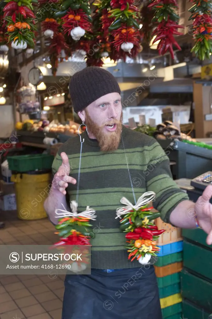 Usa, Washington State, Seattle, Pike Place Market, Produce Stand, Vendor Goofing Around With Chili Pepper Arrangement