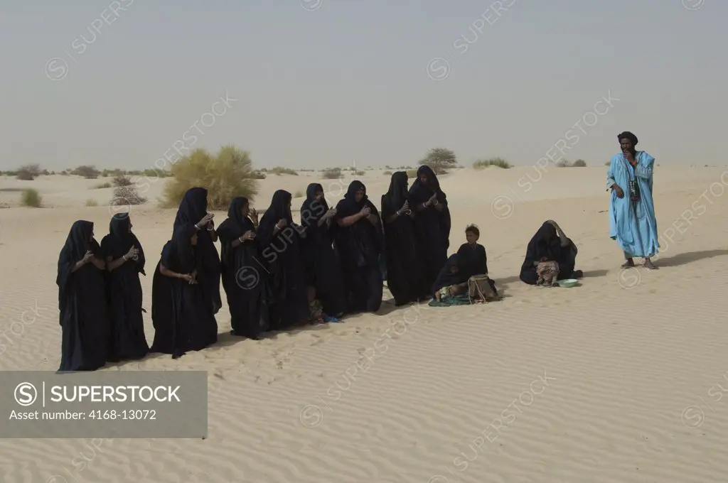 Mali, Near Timbuktu, Sahara Desert, Tuareg People Performing Traditional Dance In Desert