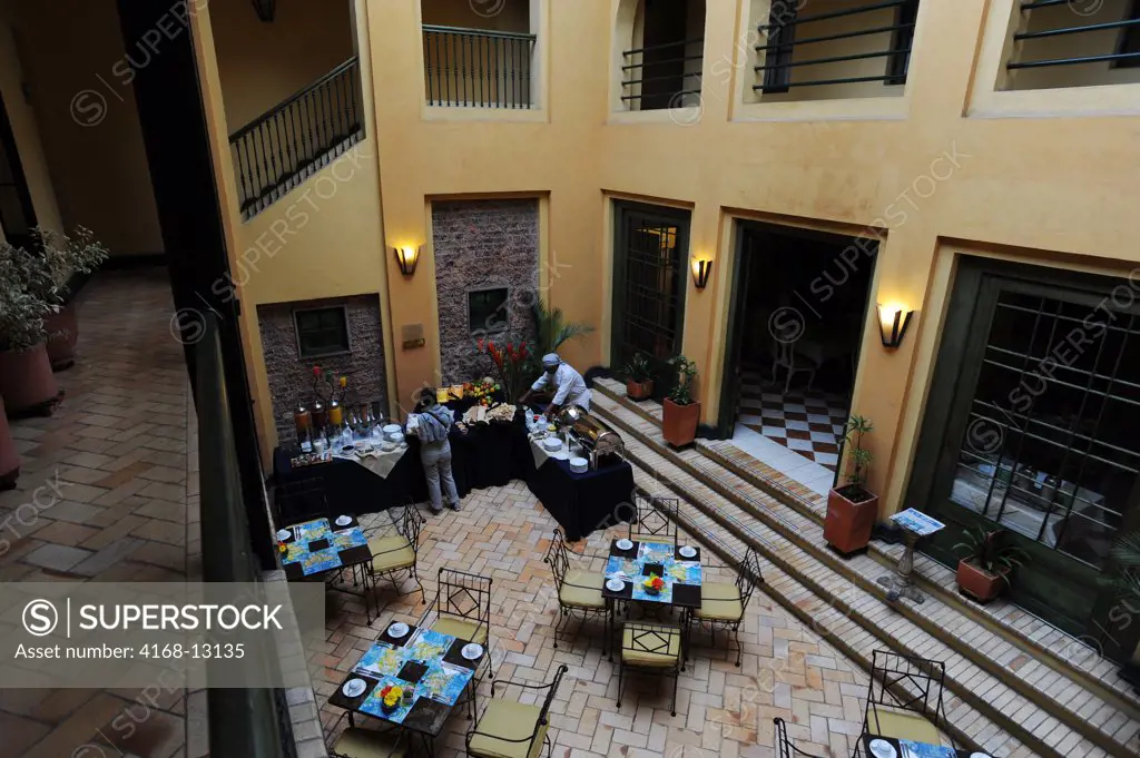 Inner Courtyard With Breakfast Buffet At Hotel De La Opera In La Candelaria, The Old Town Of Bogota, Colombia