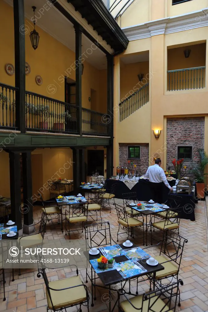 Inner Courtyard With Breakfast Buffet At Hotel De La Opera In La Candelaria, The Old Town Of Bogota, Colombia