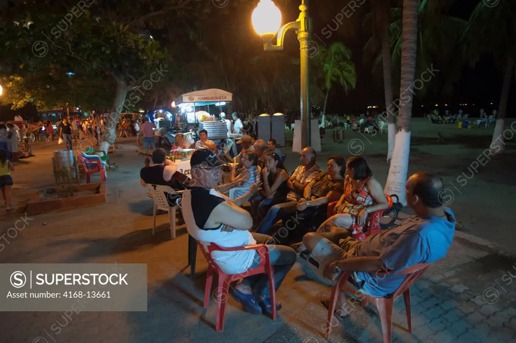 People Enjoying Evening On Beach Promenade Of El Rodadero, Santa Marta, Colombia