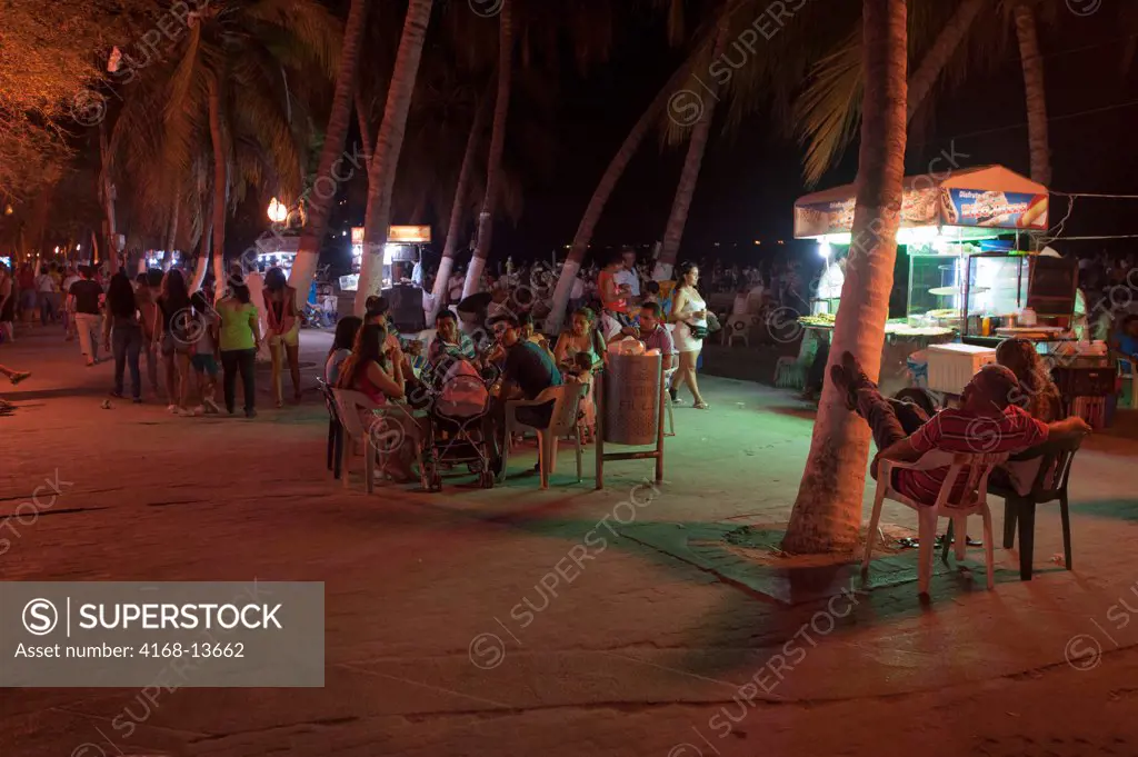 People Enjoying Evening On Beach Promenade Of El Rodadero, Santa Marta, Colombia