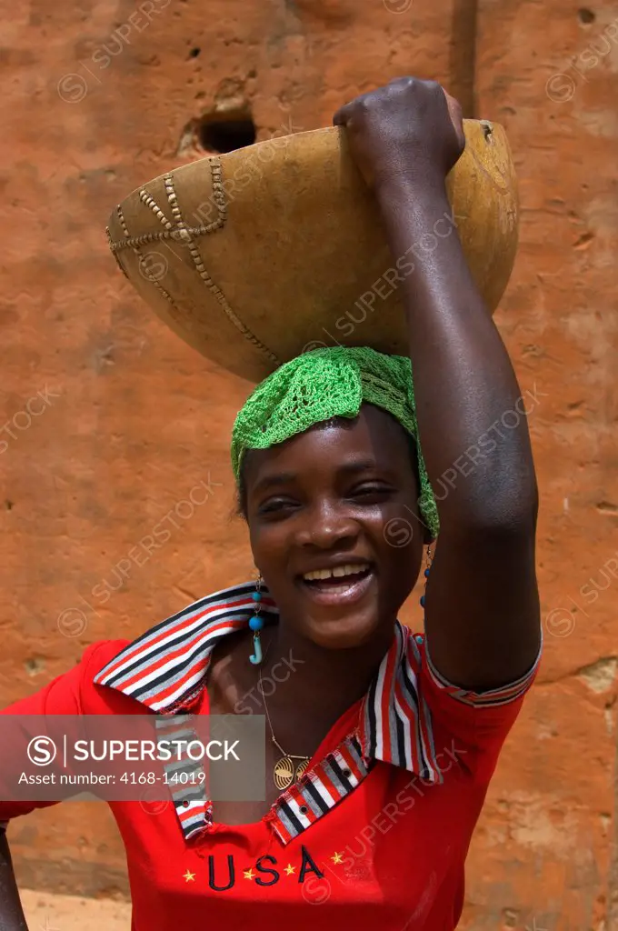 Mali, Near Segou, Segoukoro Village (Bambara Tribe), Teenage Girl With Calabash On Head
