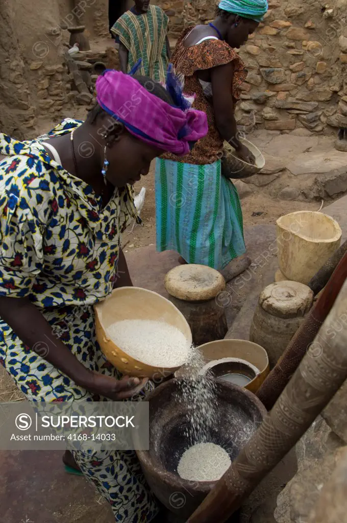 Mali, Near Bandiagara, Dogon Country, Niogono Dogon Village, Dogon Woman With Millet