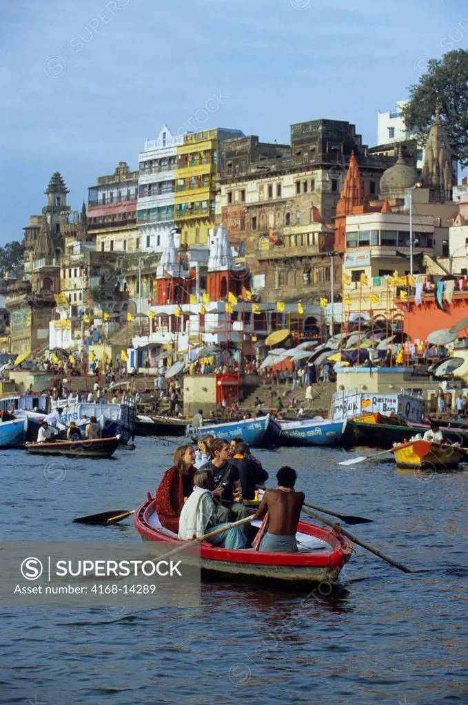 India, Varanasi, Ganges River, View Of Riverfront, Tourists In Boat