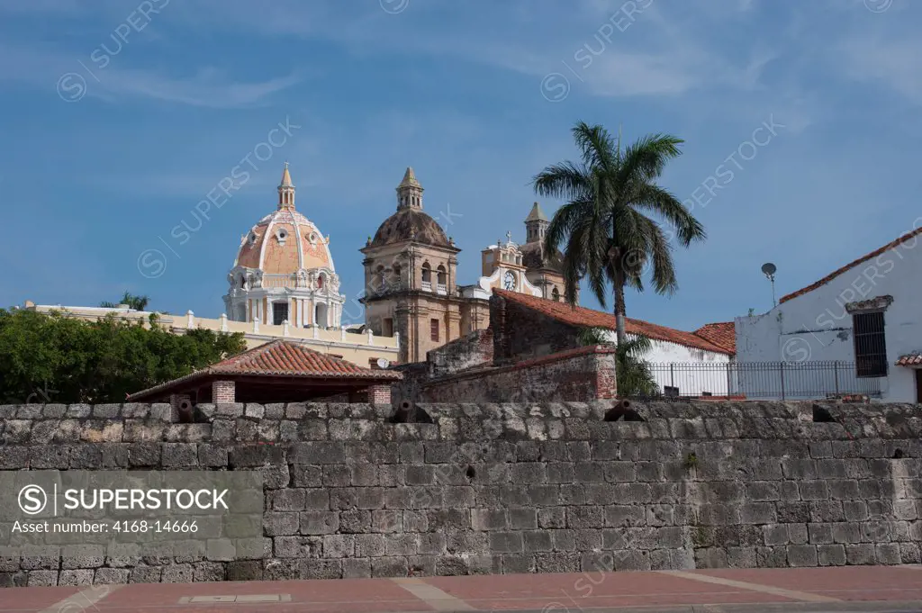 City Wall Of The Old Walled City Of Cartagena, Colombia With San Pedro Claver Church In Background