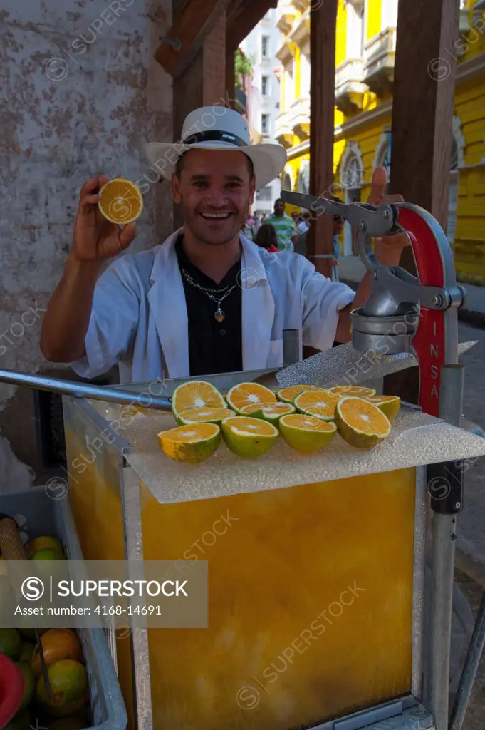 Street Vendor Selling Fresh Orange Juice In The Streets Of Cartagena, Colombia