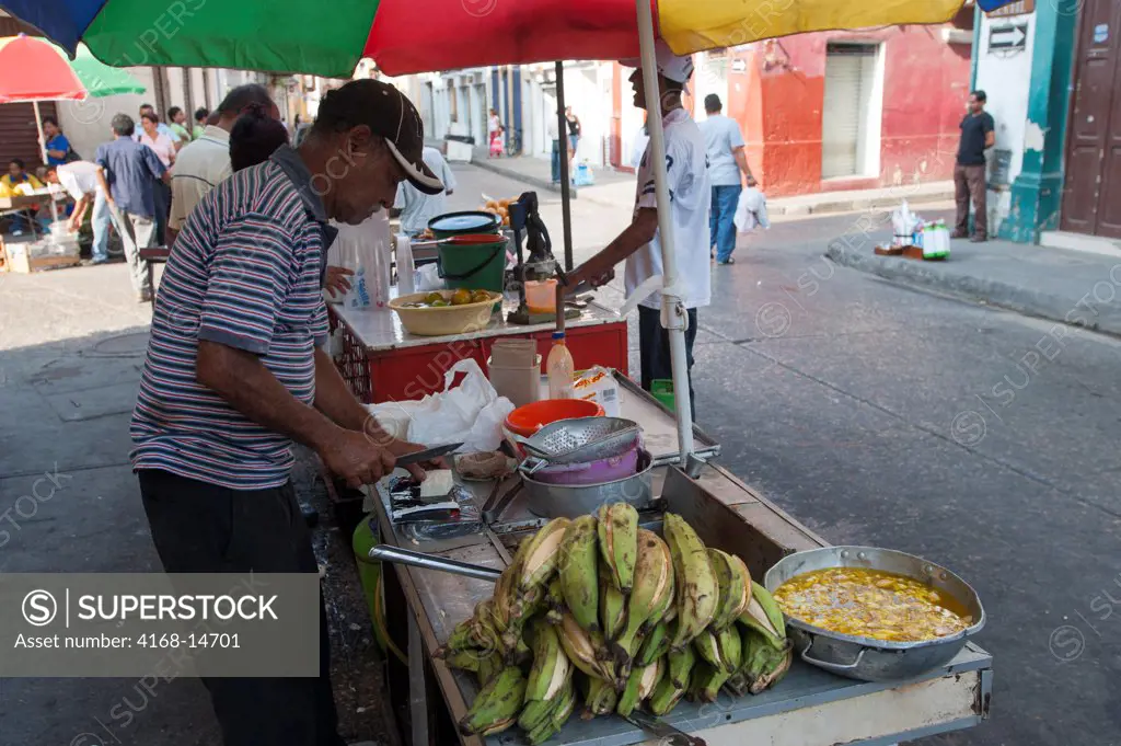 Street Vendor Preparing Fried Plantains In The Streets Of Cartagena, Colombia