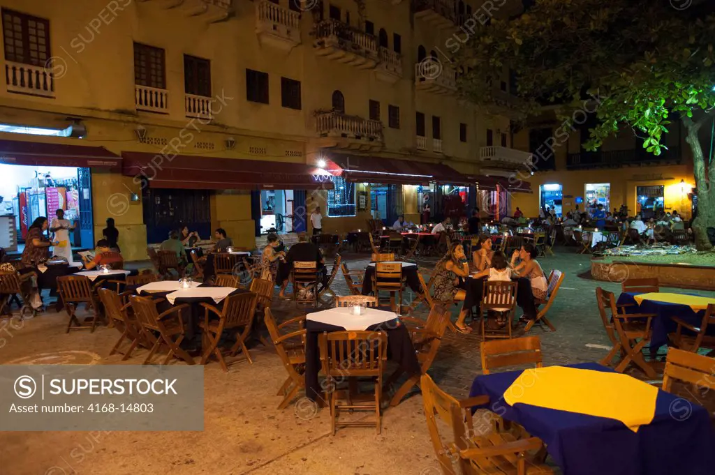 Outdoor Restaurants At Night On Plaza Santo Domingo In Cartagena, Colombia, A Walled City And Unesco World Heritage Site