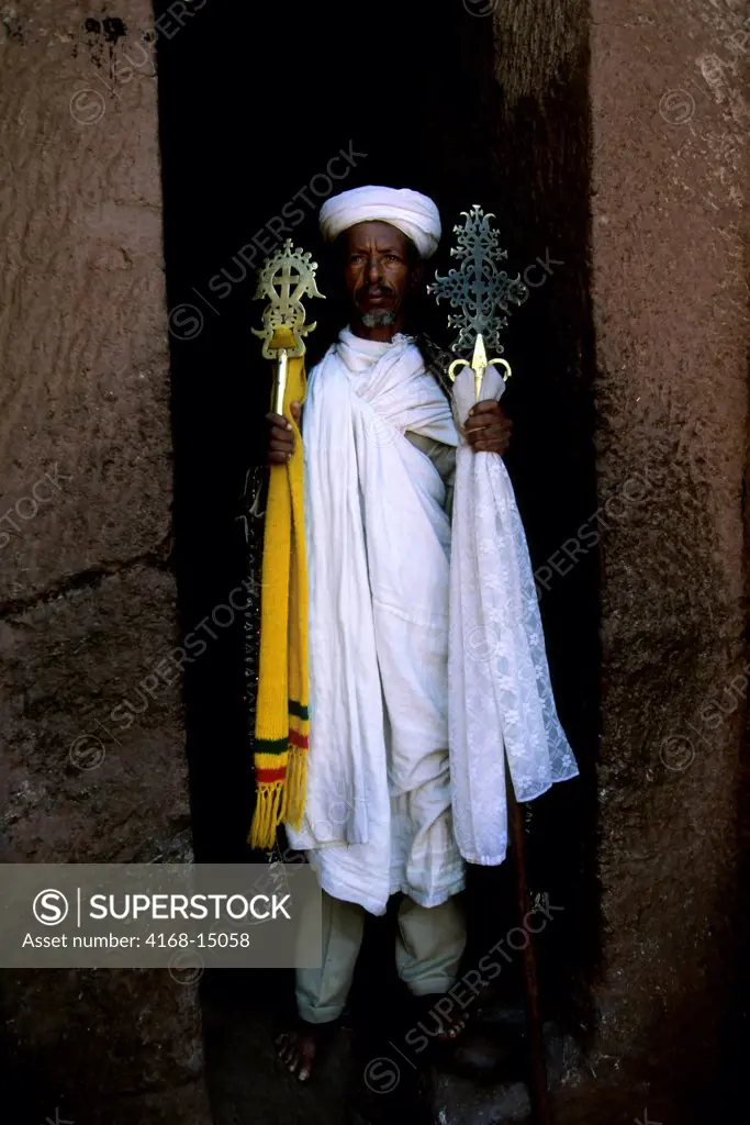 Ethiopia, Lalibela, Unesco World Heritage Site,  Church Carved Into Rock, Priest With Cross