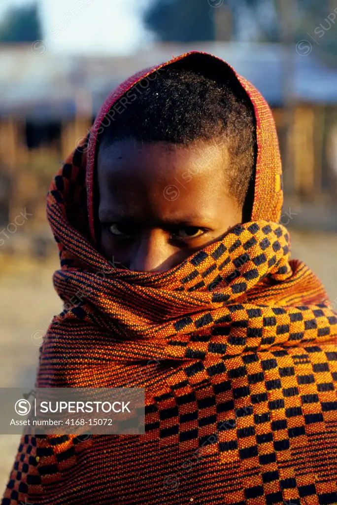 Ethiopia, Near Bahar Dar, Small Village, Boy Draped In Colorful Cloth